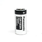 A single Panasonic CR123A industrial lithium battery standing upright on a white background.